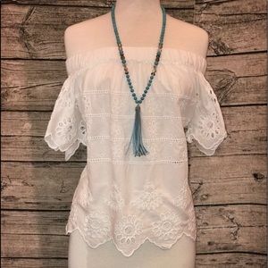 White embroidered off the shoulder blouse